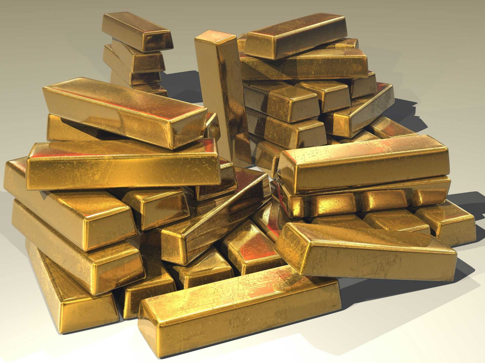 a-pile-of-lustrous-gold-bars A pile of lustrous gold bars.